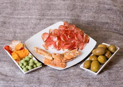 a plate of food with different types of fruit at Sprechenstein in Vipiteno