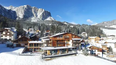 a resort in the mountains with snow on the ground at Gourmet Hotel Gran Ander in Badia