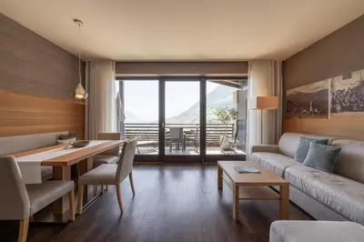 a living room with a couch and a table at Alagundis Apartment Residence in Lagundo