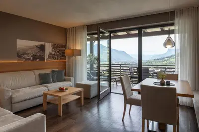 a living room with a couch and a table at Alagundis Apartment Residence in Lagundo