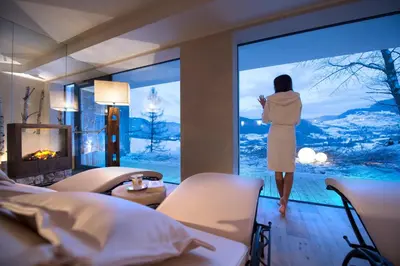 a woman looking out the window of a hotel room at Residence St Konstantin in Fiè