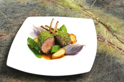 a plate of food with broccoli and other vegetables at Hotel Teresa in San Vigilio Di Marebbe