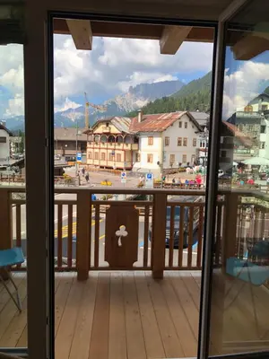 a view of a city from a balcony at Cèsa Mia in Campitello di Fassa
