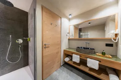 a bathroom with a shower and a sink at Garni Mia Co in Antermoia