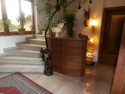 a hallway with a staircase with plants on the wall at B&B - Apartments Sunnwies in Marlengo