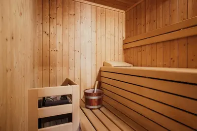 a sauna with a trash can and a bucket at Residence Costa Burjada in Colfosco