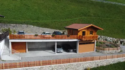 a parking lot with cars parked in a garage at Tallnerhof in Schenna