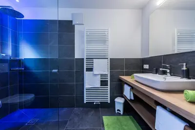 a bathroom with a sink and a shower at Tallnerhof in Schenna