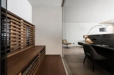 a living room with a desk and a chair at Hotel Viertler in Avelengo