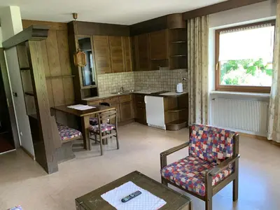 a kitchen with a couch and a chair and a table at Appartments Hilber in Brunico