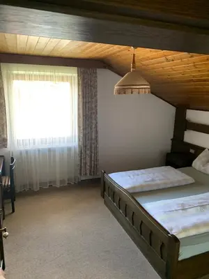 a bedroom with two bunk beds and a window at Appartments Hilber in Brunico