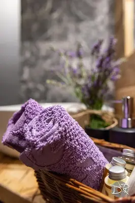 a purple towel sitting on a counter next to a sink at Casa de Fiemme in Tesero
