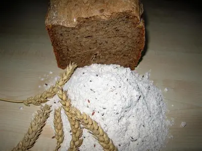 a loaf of bread sitting on top of a table at Agriturismo Ferienhof Gschloier - Adults Only in Laion