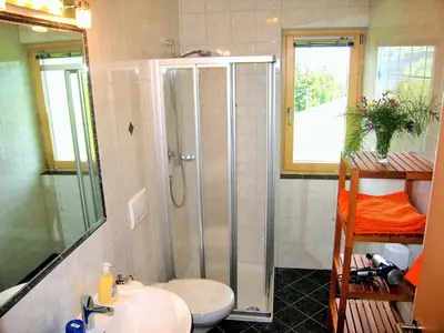 a bathroom with a shower and a sink at Agriturismo Ferienhof Gschloier - Adults Only in Laion