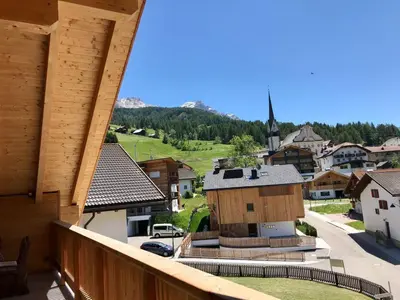 a view of a town from the balcony of a house at Apartments Chalet Maria in Badia