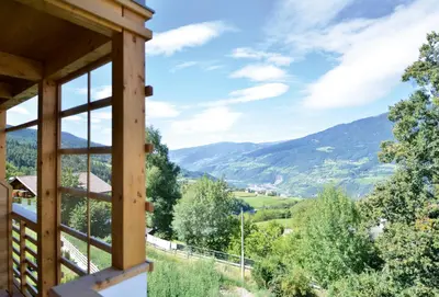 a view from the porch of a house with mountains in the background at Appartment Silvia in St Andrä bei Brixen in Bressanone