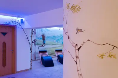 a bee on the wall of a house at FORESTO holiday apartments in Tesero