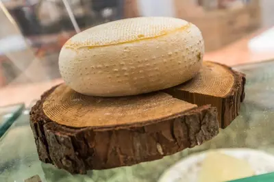 a loaf of bread sitting on top of a piece of wood at Agritur Ciasa Dò Parè in Soraga