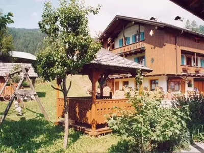 a house with a gazebo in front of it at Agritur Ciasa Dò Parè in Soraga