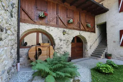 an entrance to a building with a wooden door at Agritur Ciastel in Sanzeno