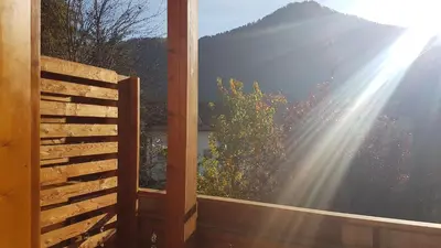 an open window with the sun shining through at Pelegrin 15 in San Vigilio Di Marebbe