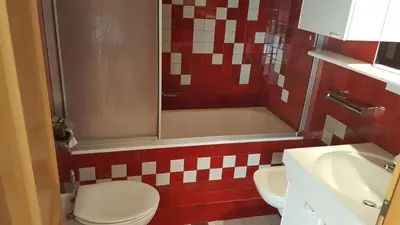 a bathroom with a toilet and a tub and a sink at Pelegrin 15 in San Vigilio Di Marebbe
