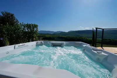 a jacuzzi tub with water in it at Apartments Windegg in Caldaro