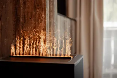 a fireplace with flames in a room with a curtain at The Laurin Small & Charming in Selva di Val Gardena