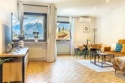 a living room with a view of a mountain at Residence Diana in Merano