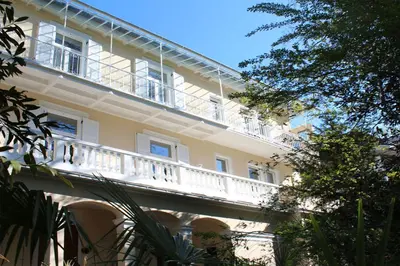 a building with a balcony on the side of it at Residence Diana in Merano