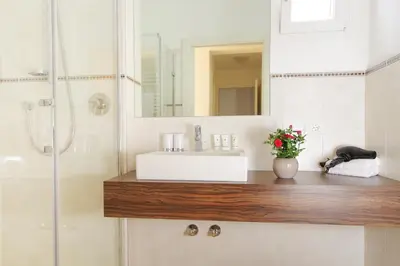 a bathroom with a sink and a shower at Residence Diana in Merano