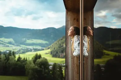 two girls looking out of a window at a valley at Gailerhof Boutique Hotel B&B Dolomites in Monguelfo