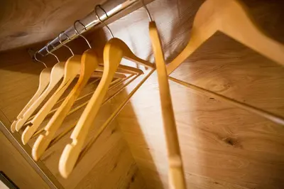 a bunch of utensils hanging on a rack at Chalet Marcora in Campitello di Fassa