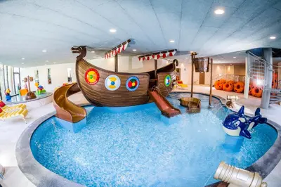 a childrens indoor playground with a pirate ship in a room at Hotel Prokulus - Family & Wellness in Naturno