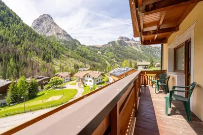 a balcony with a view of the mountains at Hotel Dolomites Inn in Canazei