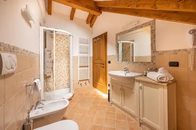 a dining room with wooden walls and two arches at Hotel Stalon Alpine Chic in San Martino di Castrozza