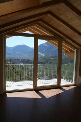a room with a window with a view of a mountain at Residence Fiegl in Schenna