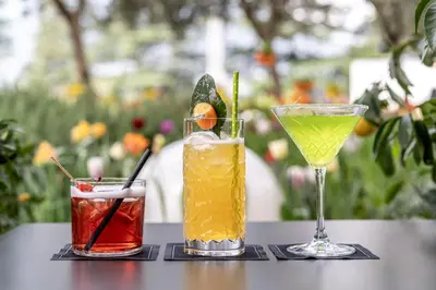 a table with two drinks on a table at Hotel Mignon Meran Park & Spa in Merano