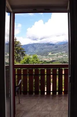 a balcony with a view of the mountains at Hotel Panorama Wellness & Resort in Malosco