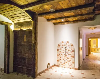 a hallway of a house with a wooden ceiling at Residence Cirelle Suite & Spa in Canazei
