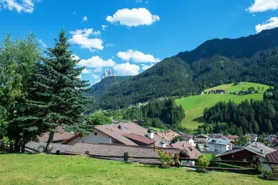 a view of a village in the mountains at Apartments Cesa Bruma in Ortisei