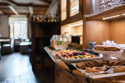 a buffet line with many different types of food at Bio Boutique Hotel Laurino in Cavalese