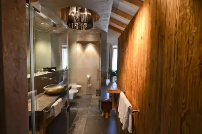 a bathroom with a sink and a glass shower at Hotel Zum Mohren in Tesimo