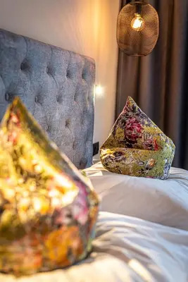 two pillows sitting on top of a bed at Hotel Zum Mohren in Tesimo