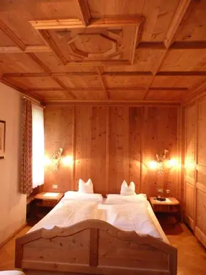 a bathroom with a sink and a bath tub at Chalet Ciasa Alexander in San Cassiano