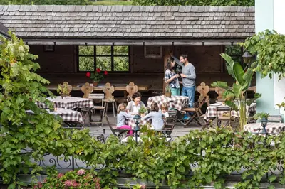 a group of people standing on a patio at Gasthof Tschötscherhof in Castelrotto