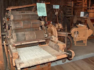 a room with a bunch of old wooden equipment at Gasthof Tschötscherhof in Castelrotto