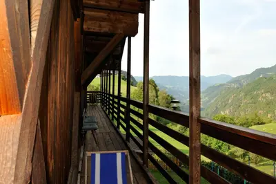 a balcony with a view of the mountains at Gasthof Tschötscherhof in Castelrotto
