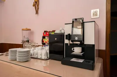 a coffee machine sitting on top of a counter at Hotel Appartement Lahngut in Nalles