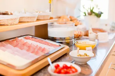 a counter with food on it with a tray of food at Rebenheim in Termeno